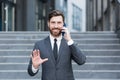 Portrait successful young confident businessman talking background urban modern office building in downtown Bearded business man Royalty Free Stock Photo