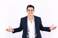 Portrait of successful young latin businessman with open arms on white background in Mexico Latin America Royalty Free Stock Photo