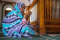 Portrait of a Sudanese woman praying.