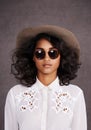 Portrait, sunglasses and woman with cowboy fashion, confidence and relax with girl in stetson hat. Rodeo, western style Royalty Free Stock Photo