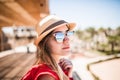 Portrait of sunny girl relaxing on summer sun wearind in hat and sunglasses. Summer vocation. Royalty Free Stock Photo