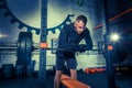 Portrait of super fit muscular young man working out in gym with barbell Royalty Free Stock Photo