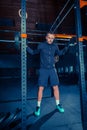 Portrait of super fit muscular young man working out in gym with barbell Royalty Free Stock Photo