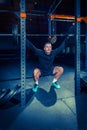 Portrait of super fit muscular young man working out in gym with barbell Royalty Free Stock Photo