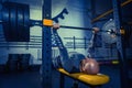 Portrait of super fit muscular young man working out in gym with barbell Royalty Free Stock Photo