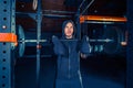 Portrait of super fit muscular young man working out in gym with barbell Royalty Free Stock Photo