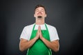 Portrait supermarket employer standing in prayer position