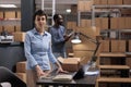 Portrait of supervisor working in storehouse delivery department checking shipping details