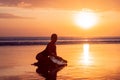 Portrait of surfer girl with beautiful body on the beach with surfboard at colourful sunset time Royalty Free Stock Photo