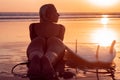 Portrait of surfer girl with beautiful body on the beach with surfboard at colourful sunset time Royalty Free Stock Photo