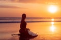 Portrait of surfer girl with beautiful body on the beach with surfboard at colourful sunset time Royalty Free Stock Photo