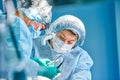 Portrait of a surgeon close-up. Surgeons operate on a patient. Tense, serious faces. Real operation. Tensioned