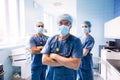 Portrait of surgeon and nurses standing in hospital Royalty Free Stock Photo