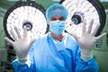 Portrait of surgeon preparing for operation in operation room