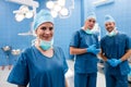 Portrait of surgeons smiling in operation room Royalty Free Stock Photo