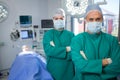 Portrait of surgeons standing in operation theater Royalty Free Stock Photo