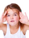 Portrait, surprise and peekaboo with a girl child in studio isolated on a white background for a playful game. Face