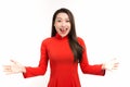 Portrait of surprised Asian woman opening her hands while wearing Ao Dai. Isolated over white background Royalty Free Stock Photo