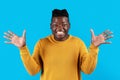 Portrait Of Surprised Black Young Man Spreading Hands With Excitement Royalty Free Stock Photo