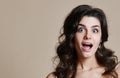 Portrait of surprised brunette girl, keeps mouth wide opened, Royalty Free Stock Photo