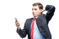 Portrait of a surprised businessman with a phone in his hand Royalty Free Stock Photo