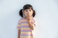 Portrait of surprised cute little toddler girl child standing isolated over white background. Looking at the camera. hands near Royalty Free Stock Photo