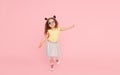 Portrait of surprised cute little toddler girl  in sunglasses over pink background.  Child model Royalty Free Stock Photo