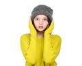 Portrait of surprised frightened teen girl in a knitted hat an