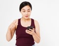 Portrait surprised happy korean woman looking at phone isolated on white background Royalty Free Stock Photo