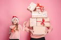 Portrait of a surprised little girl with her father holding a Christmas present Royalty Free Stock Photo