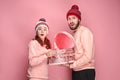 Portrait of a surprised little girl with her father holding a Christmas present Royalty Free Stock Photo