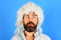 Portrait of surprised man with beard and mustache in white wig. Party time. Stylish bearded male model in curly wig