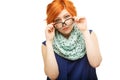 Portrait of surprised red-haired young woman holding glasses on Royalty Free Stock Photo
