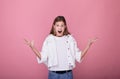 Portrait of a surprised screaming girl with hands up Royalty Free Stock Photo