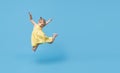 Portrait of surprised smiling cute little toddler girl. child standing isolated over blue background. Royalty Free Stock Photo