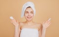 Portrait of surprised woman after bath. Beauty face of a cheerful attractive girl with towel on head, isolated Royalty Free Stock Photo