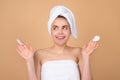 Portrait of surprised woman after bath. Beauty face of a cheerful attractive girl with towel on head, isolated Royalty Free Stock Photo