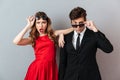 Portrait of a surprised young couple dressed in formal wear Royalty Free Stock Photo