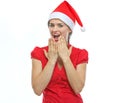 Portrait of surprised young woman in Santa hat Royalty Free Stock Photo