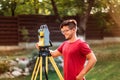 surveyor engineer using equipment with theodolite and total station at a construction site Royalty Free Stock Photo