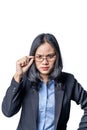 Portrait of a suspicious arrogant young businesswoman looking over her glasses. Confident Asian female business specialist with co