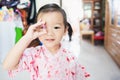 Sweet Asian little child smile and holding hair clip, hair dressing concept