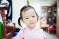 Sweet Asian little child with look askance face, confused concept Royalty Free Stock Photo