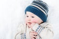 Portrait of a sweet baby in a warm knitted hat and sweater Royalty Free Stock Photo