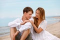 Portrait of a sweet couple of young people resting on the beach Royalty Free Stock Photo