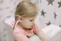 portrait of a sweet funny toddler girl at home. Cute baby girl reflection in a white bathroom Royalty Free Stock Photo