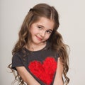 Sweet little girl looking shy and smiling Royalty Free Stock Photo