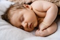 Portrait of sweet sleeping newborn baby in bed Royalty Free Stock Photo