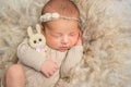 Portrait of sweet sleeping newborn girl with toy hare Royalty Free Stock Photo