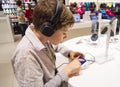 Portrait of a sweet young boy listening to music Royalty Free Stock Photo